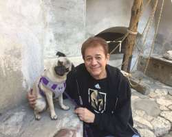 He is fond of dogs and has a pet dog.